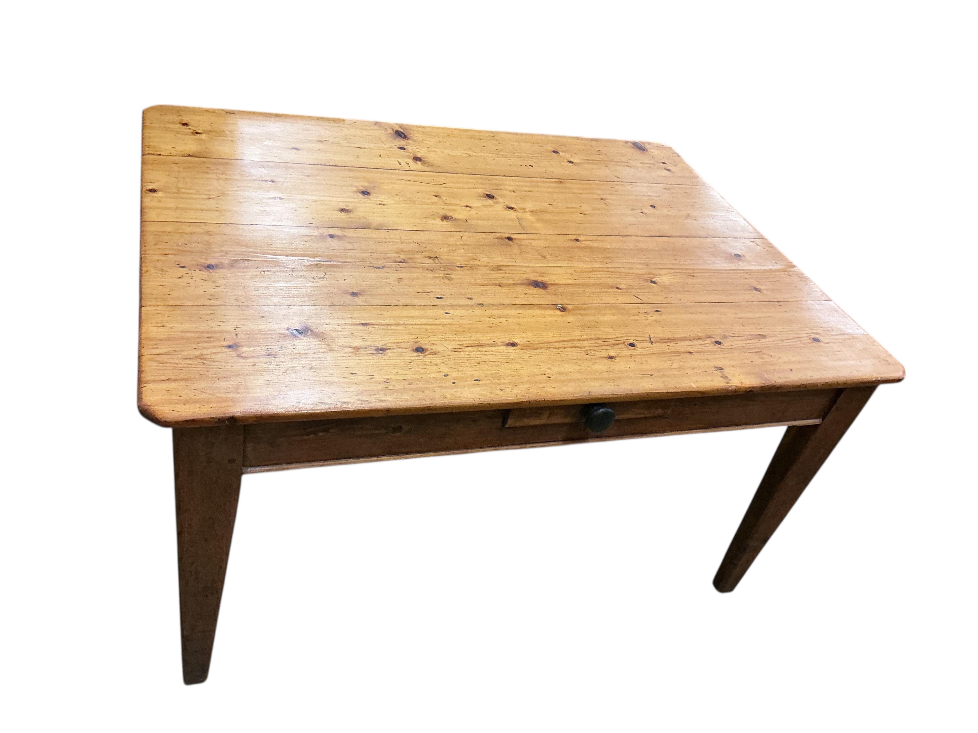 A mid 19th century rectangular pine kitchen table, fitted drawer on square tapered legs, width 136cm, depth 104cm, height 72cm